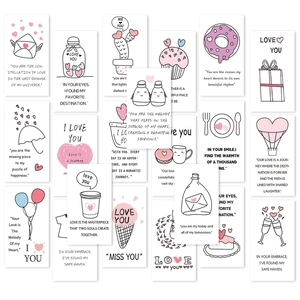 Detailed flat lay of mini lunch box notes with romantic hand-drawn illustrations and quotes