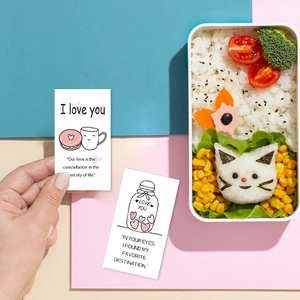 Close-up of romantic lunch box lunchbox cards with cute illustrations for couple's gift