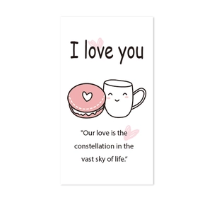Close-up of romantic lunch box card featuring sweet macaron and coffee mug illustrations