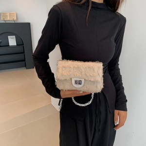 Elegant cream woven small square bag with silver chain strap and metal lock clasp