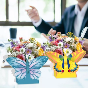 Floral butterfly gift boxes in blue and yellow watercolor paper for party favors