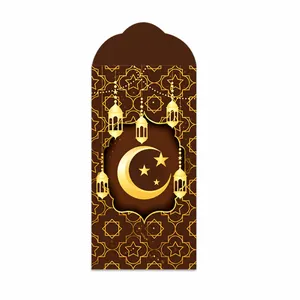 Macro detail of Eid Ramadan envelope with golden moon and lantern on brown paper