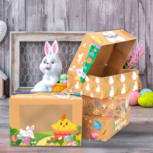 Detail of Easter candy boxes with transparent window featuring bunny and egg patterns