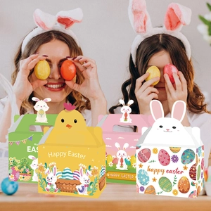 Close-up of Easter candy gift boxes with handles, featuring bunny and chick designs