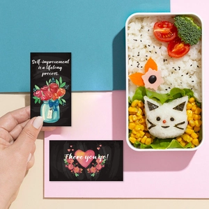 Detail of chalkboard style lunchbox cards with hand-drawn flowers and quotes