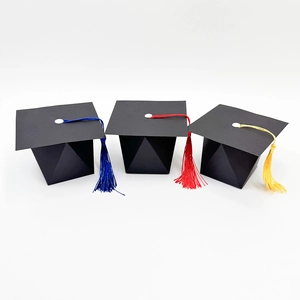 Creative graduation cap candy boxes with colorful tassels in blue red and yellow