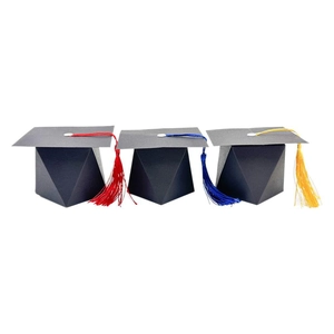 Three black graduation cap gift boxes with red blue and yellow silk tassels for party favors