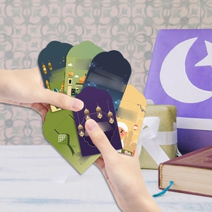 Detail view of colorful Eid Mubarak money envelopes featuring mosques and star moon motifs