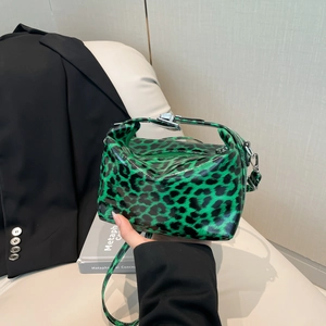 Green and black leopard print patent leather handbag with silver lock and shoulder strap