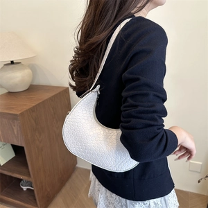 Elegant white crescent shoulder bag featuring a woven texture for casual daily fashion