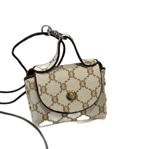 Mini crossbody handbag with classic brown print and gold buckle on creamy white leather
