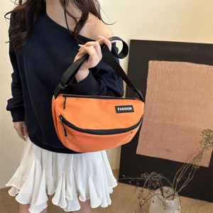 Casual bright orange canvas crossbody sling bag for women with fashion rubber logo