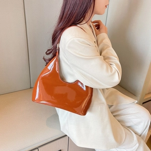 Chic caramel brown patent leather hobo bag for women in a stylish casual spring design