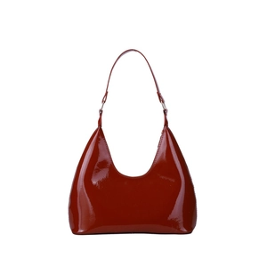 Glossy patent leather underarm bag in reddish brown with elegant retro curved silhouette