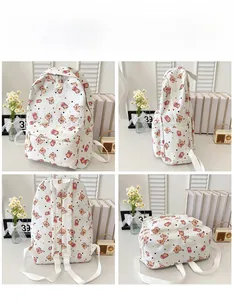 Multiple views showing the front, side, and back of a white cartoon pattern canvas backpack