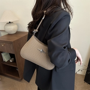 Khaki woven underarm bag for women with silver star hardware and elegant shoulder strap