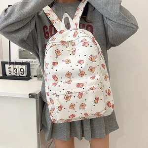 Cute white backpack with cartoon animal prints and large capacity for school and travel