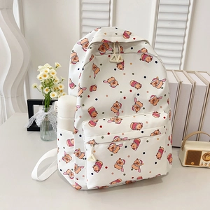 Cute white canvas backpack with colorful polka dots and a cartoon bear for students