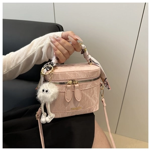 Pink marbled textured box bag with silk scarf handle and plush doll pendant detail