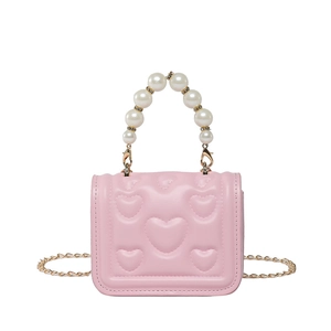 Pink heart-embossed crossbody bag with luxury pearl handle and gold chain strap