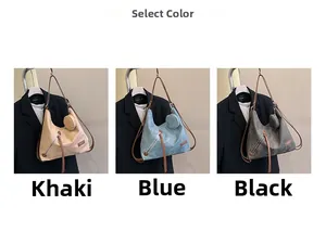 Three large tote bags in khaki, blue, and black with round coin purses and metal zippers