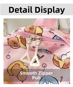 Detailed close-up of smooth dual zippers on a pink cartoon kids' backpack