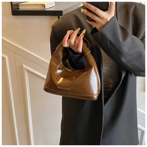 Chic coffee brown patent leather hobo bag with Fashion & Bags print and top handle