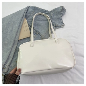 Detail of white PU leather tote bag showing fine stitching and casual shoulder straps