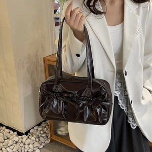 Brown faux leather tote bag with bow-knot pockets and glossy finish for women