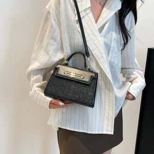 Chic black sequin crossbody bag for women with gold hardware and leather top handle