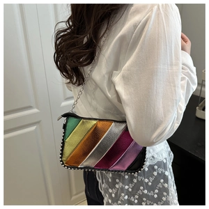 Detail view of colorful metallic striped PU leather bag with silver rivets and chain strap