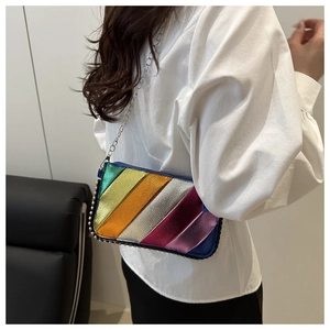 Side view of rainbow striped crossbody bag with silver studs and chain strap