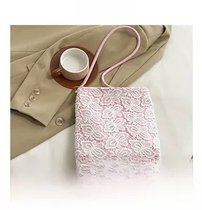 Detailed texture of pink floral lace bucket bag on a minimalist lifestyle setting
