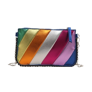 Rainbow metallic crossbody bag with silver rivet trim and delicate chain strap