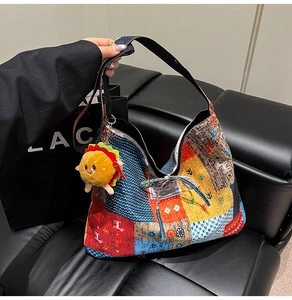 Macro shot of patchwork hobo bag detailing mixed prints with hamburger plush charm