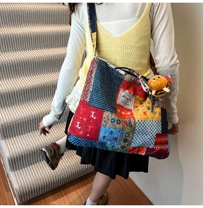 Detailed patchwork canvas tote bag with colorful patterns and a cute hamburger charm