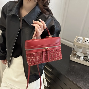 Chic red and gold tweed vanity bag with leather handle and metallic zipper detailing