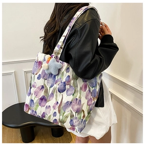 Floral canvas tote bag with purple tulips and blue star plush charm detail
