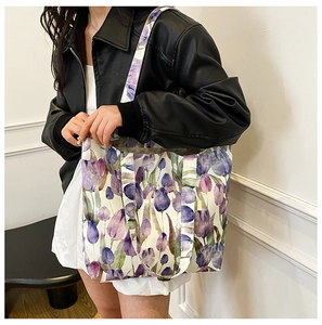 Detailed view of purple tulip floral canvas tote bag showing thick fabric and print