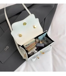 Internal view of white vintage handbag showing spacious storage for phone and makeup