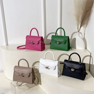 Minimalist solid color women handbag set with bow-style flap and gold rotating lock design