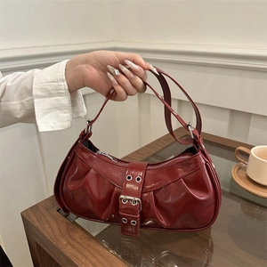 Retro deep red patent leather hobo bag with pleated texture and stylish belt buckle detail
