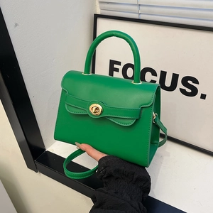 Retro bright green Kelly bag with bow detail and gold metal twist lock for women