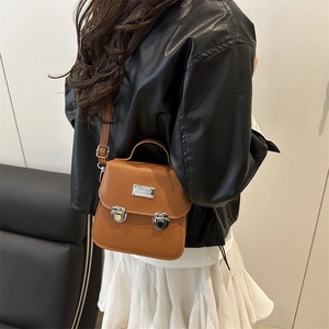 Classic brown messenger bag with silver buckles and adjustable shoulder strap