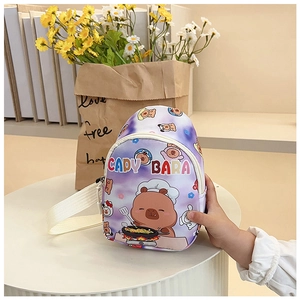 Detail of purple Capybara pattern on a children crossbody bag with adjustable strap
