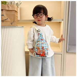 Kids capybara crossbody bag with adjustable strap shown on a child for size reference
