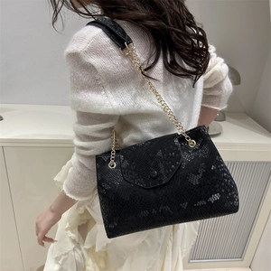 Women's black faux snakeskin shoulder bag with gold chain strap, stylish summer tote