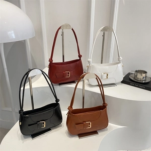 Minimalist leather baguette bags in four colors with gold buckle and knotted strap detail