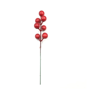 Macro detail of artificial Christmas red berries on branches for DIY holiday decor