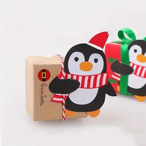 Detail of Christmas penguin decorative paper cards for lollipop and gift packaging